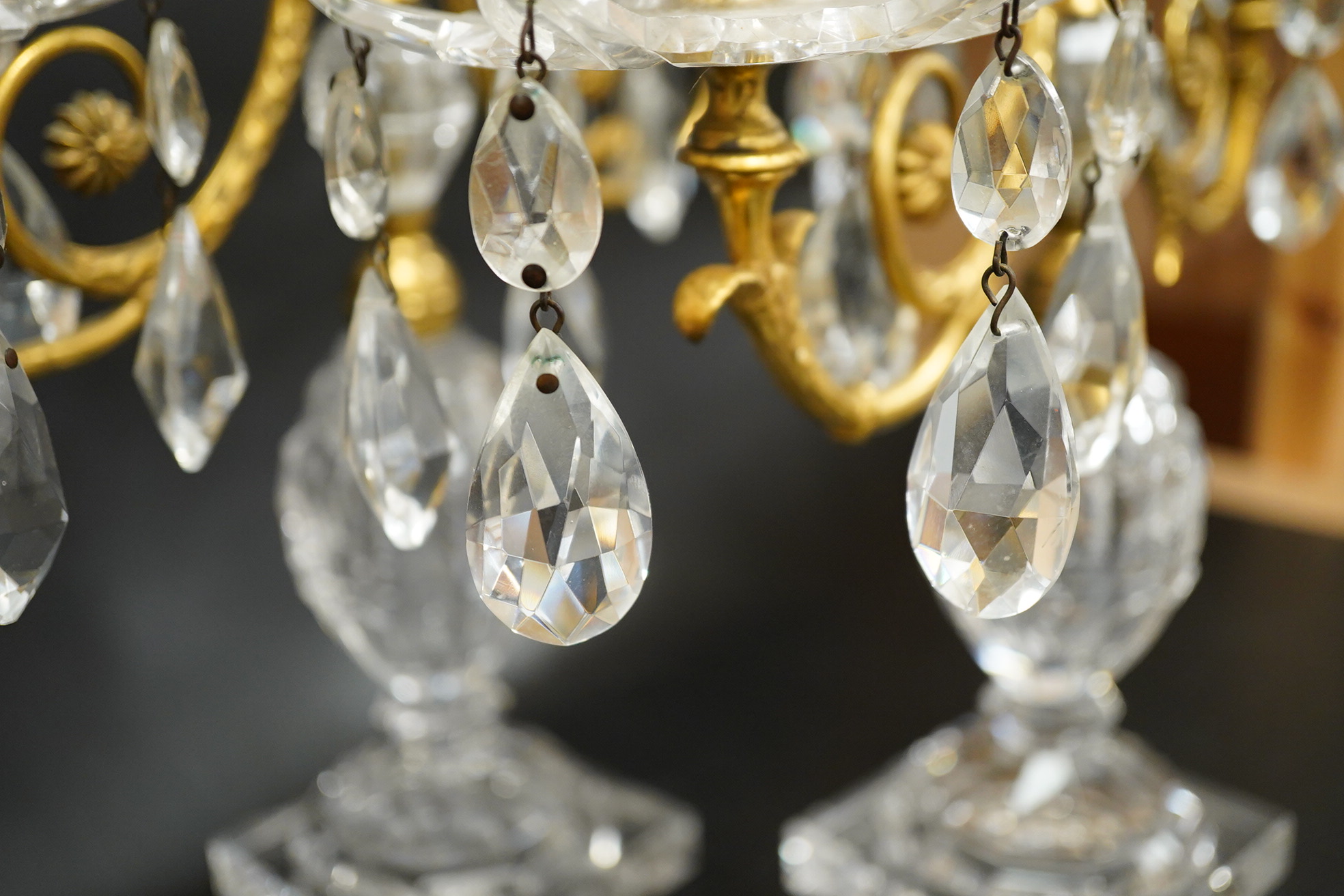 A pair of 19th century glass and gilt metal two branch candelabra with drops, 40cm high